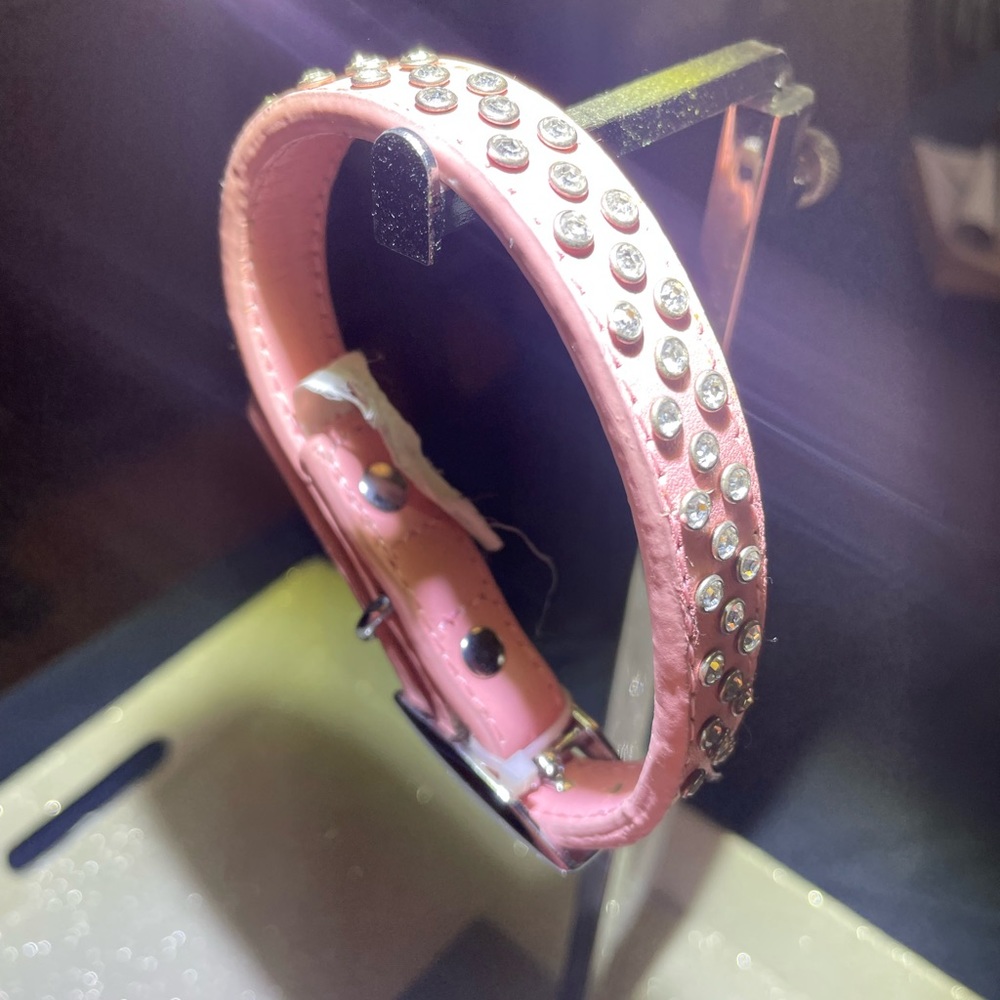 Leather Doggy collar with 50 rhinestones silver buckle that’s adjustable.